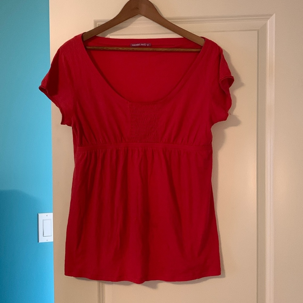 Woman’s top in good condition no damage, minimal wear. Dot detailing